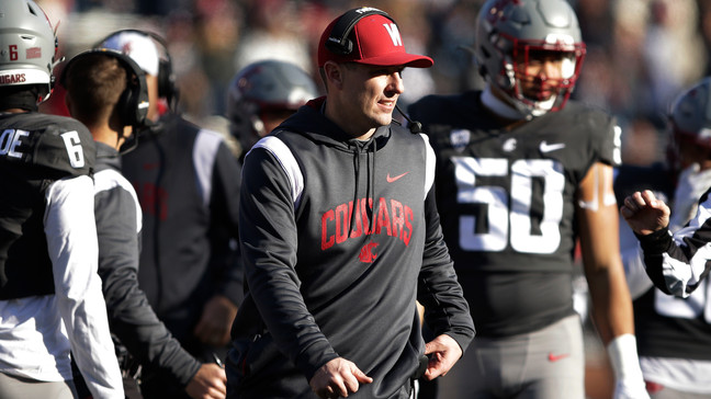 Washington State head coach Jake Dickert, center, walks on the field during a break in play in the first half of an NCAA college football game against Arizona State, Saturday, Nov. 12, 2022, in Pullman, Wash. (AP Photo/Young Kwak)