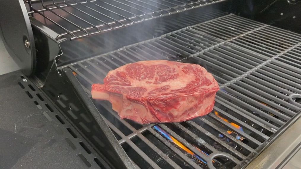 A photo of a ribeye steak on a propane grill. (Photo: KOMO News via Consumer Reports)
